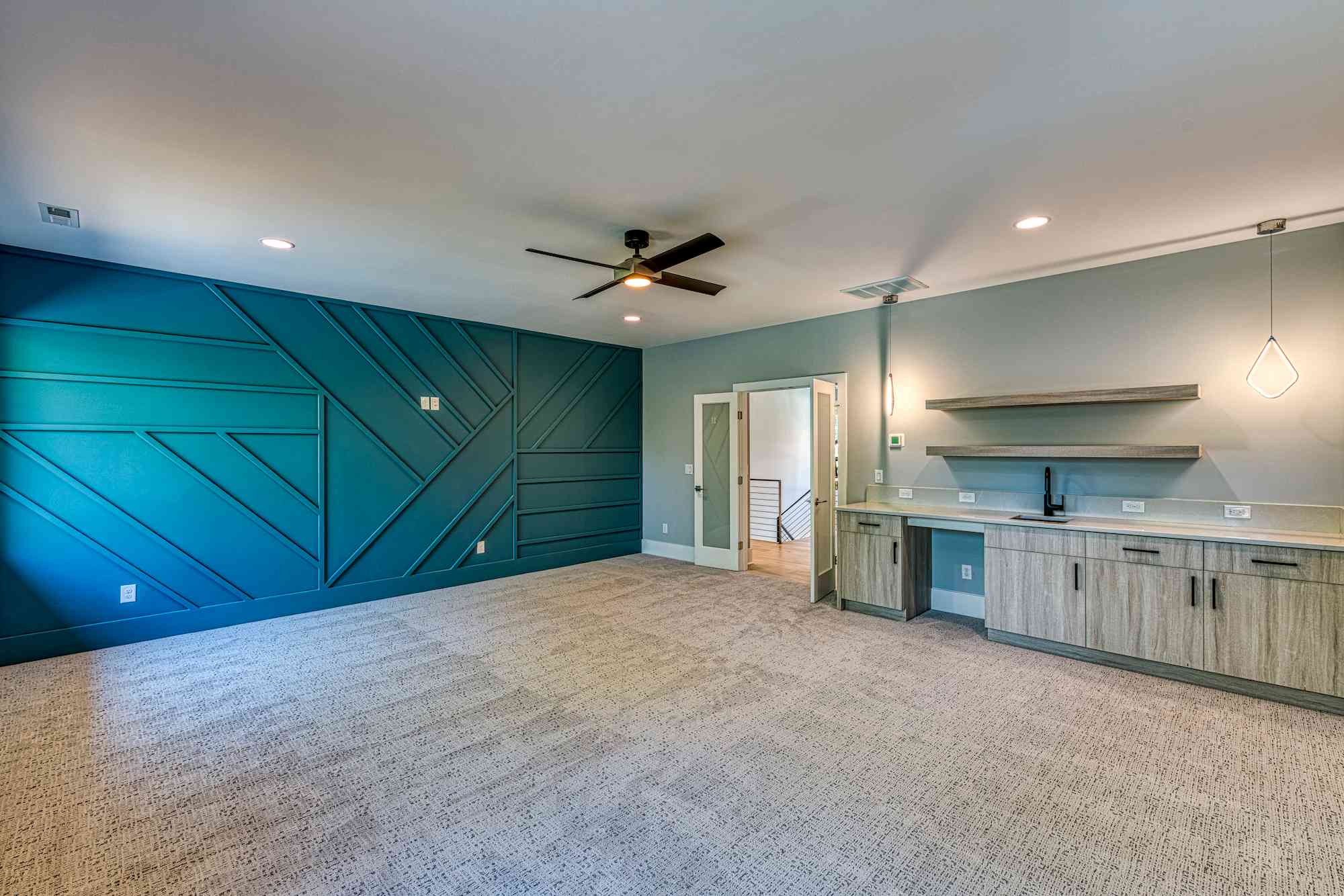 Lower level lounge with billiards table by Shail Construction in Raleigh NC