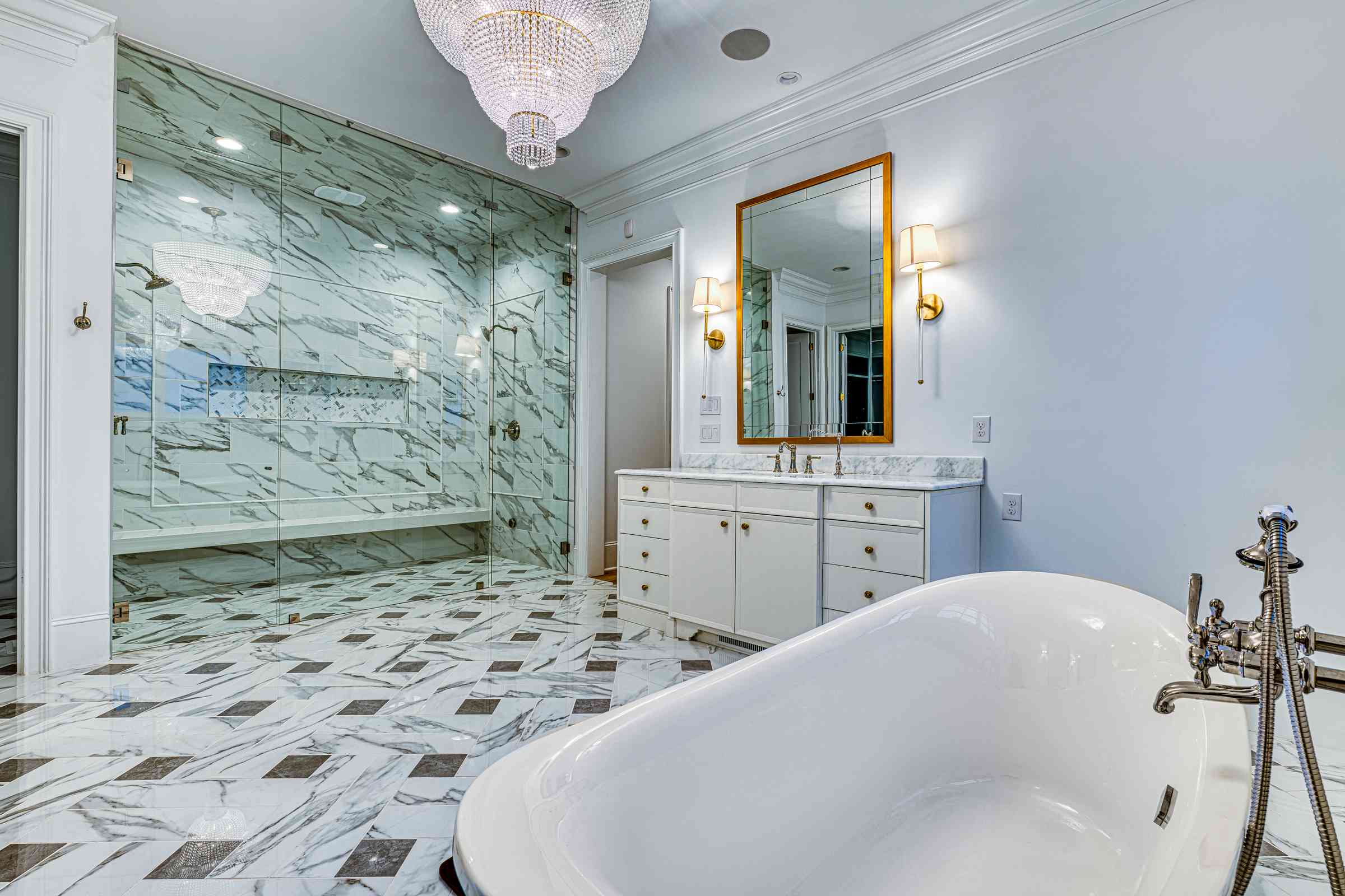 Owners suite bathroom with marble surround by Shail Construction in Raleigh NC
