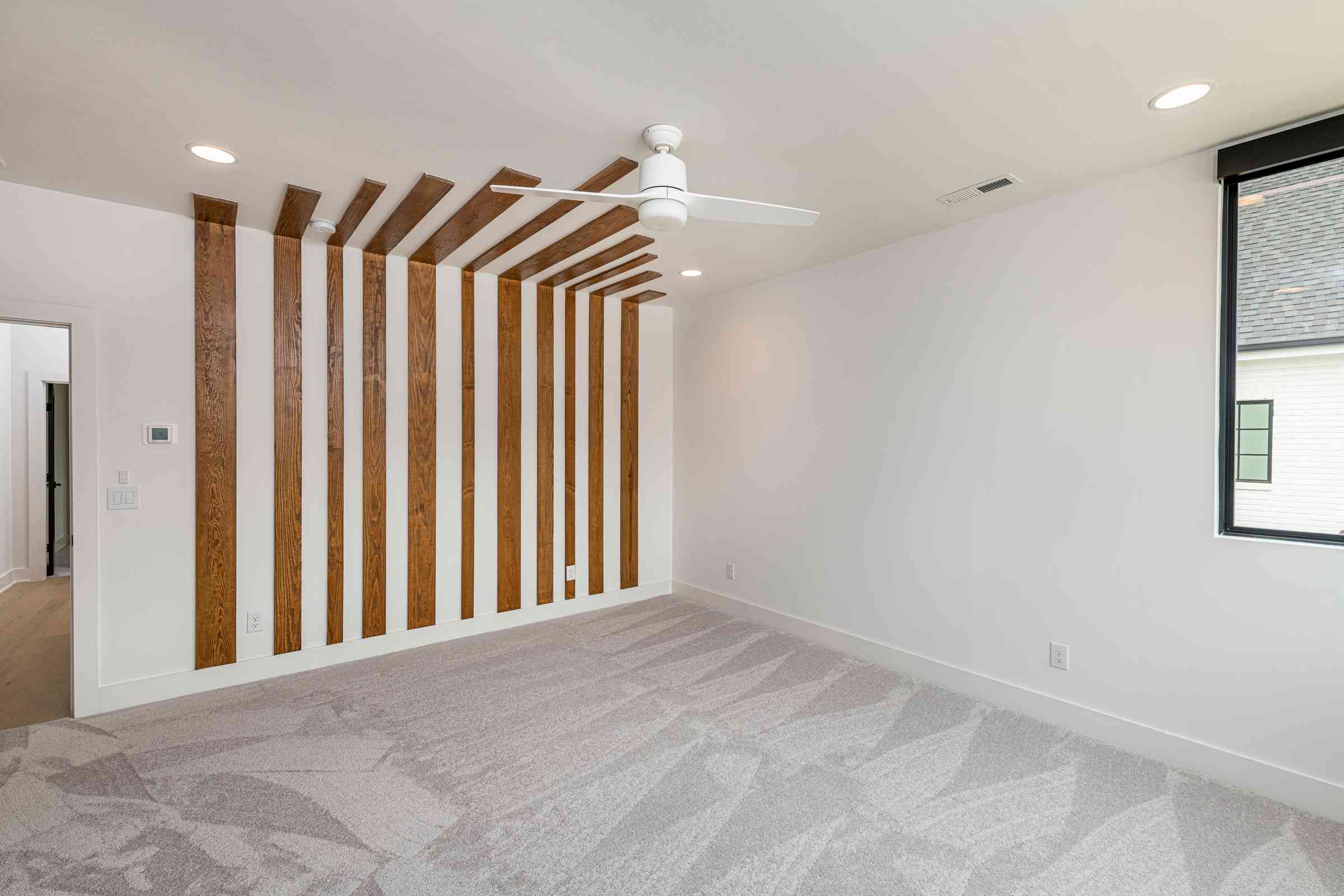 Light-filled primary bedroom with bay window by Shail Construction in Raleigh NC