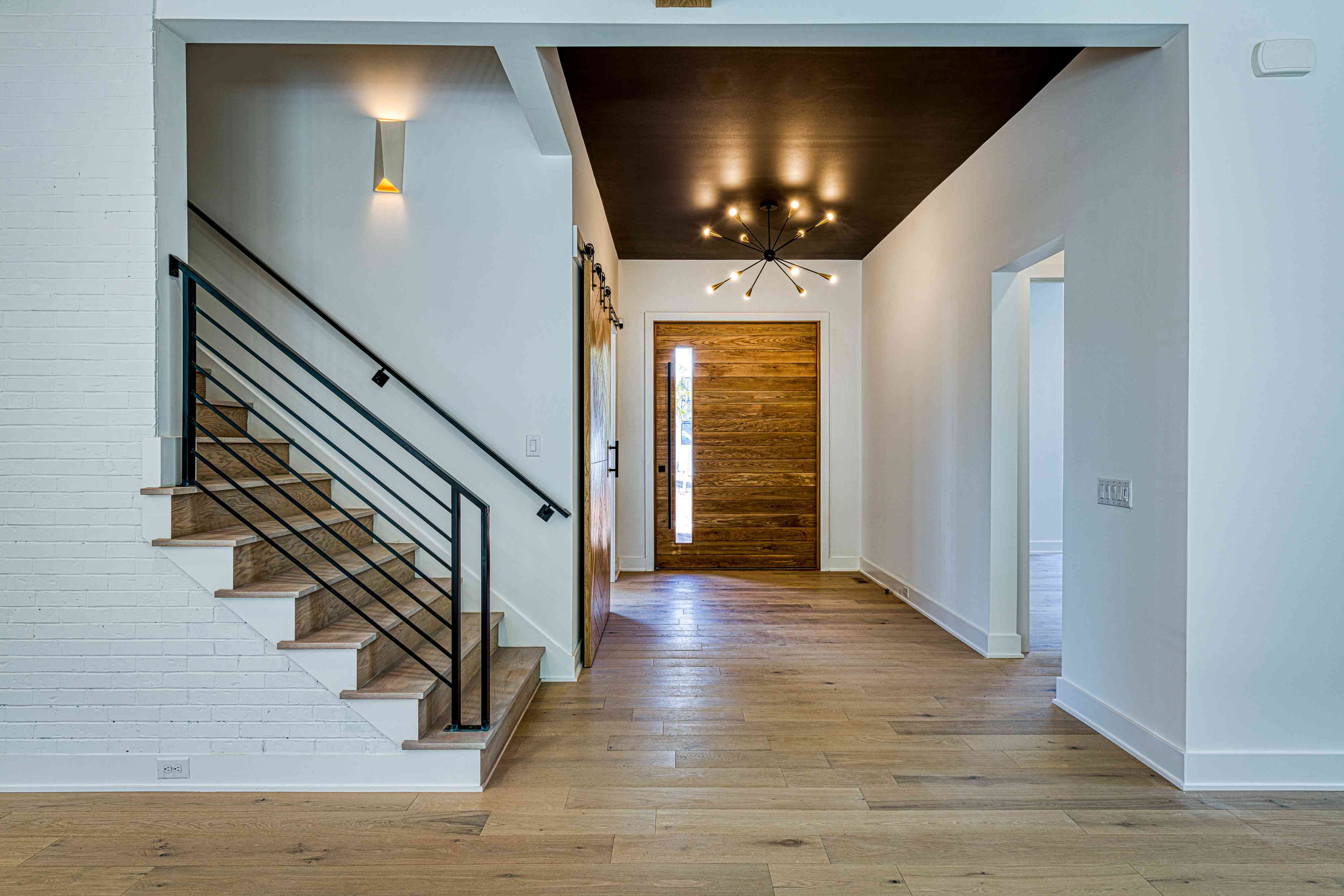 Two-story foyer with detailed ceiling moulding by Shail Construction in Raleigh NC