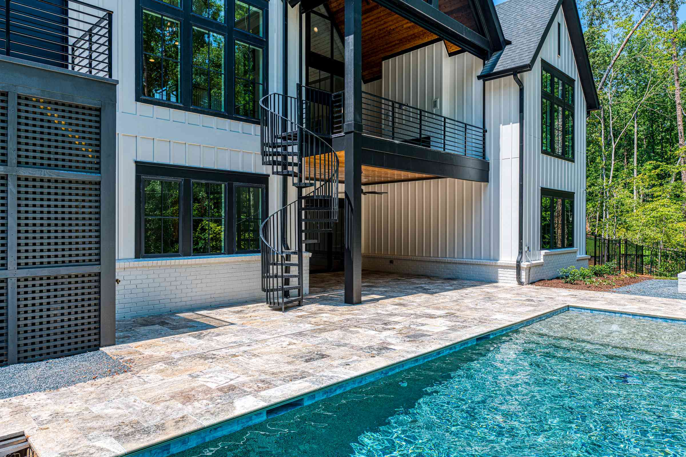 Rear estate elevation with covered patio by Shail Construction in Durham NC