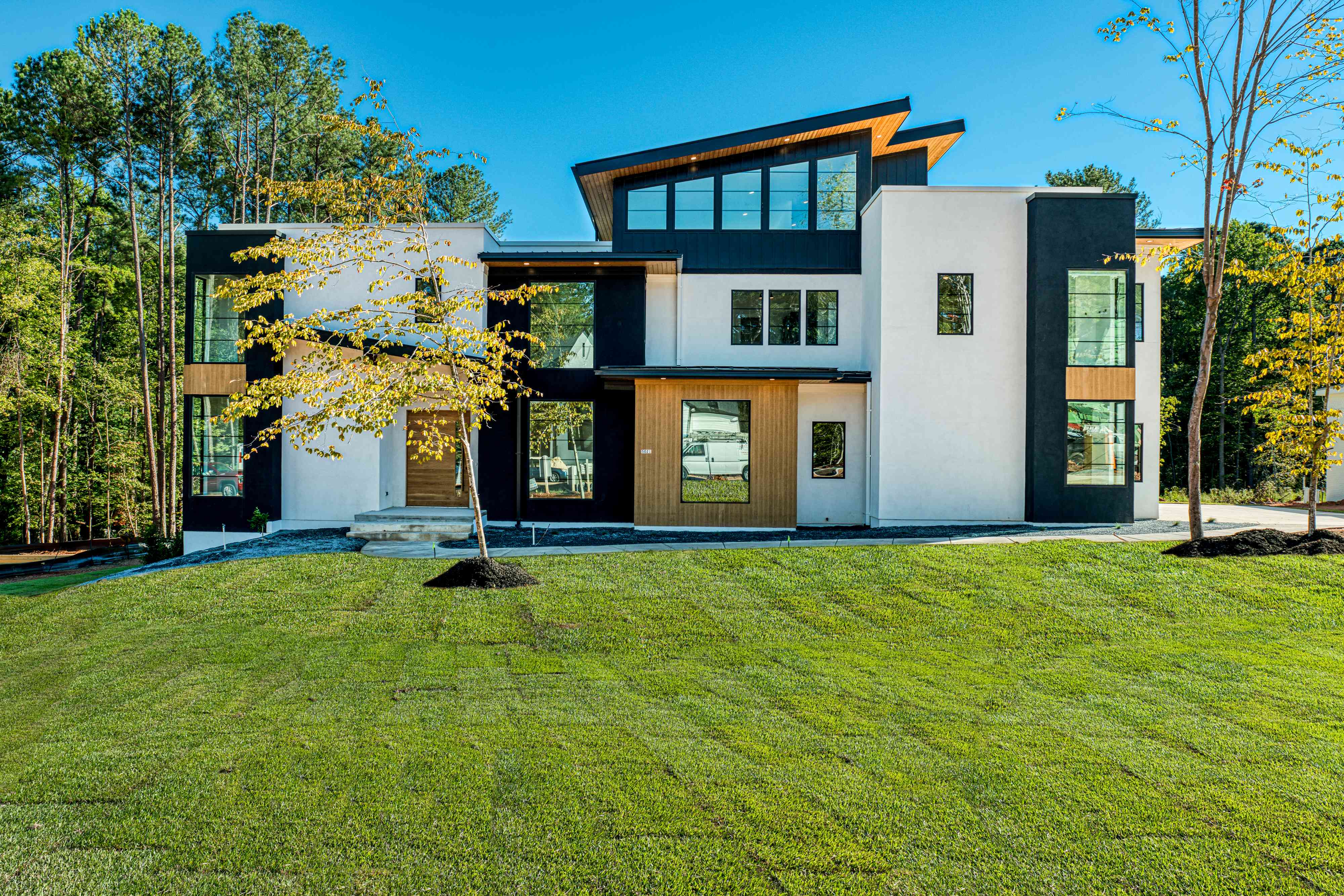 Stone and brick front exterior of a luxury custom home by Shail Construction in Raleigh NC