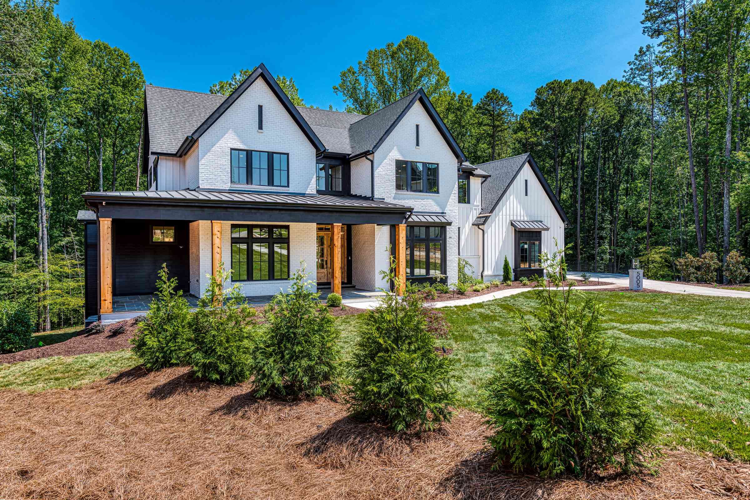 Painted brick custom home elevation by Shail Construction in Wake Forest NC