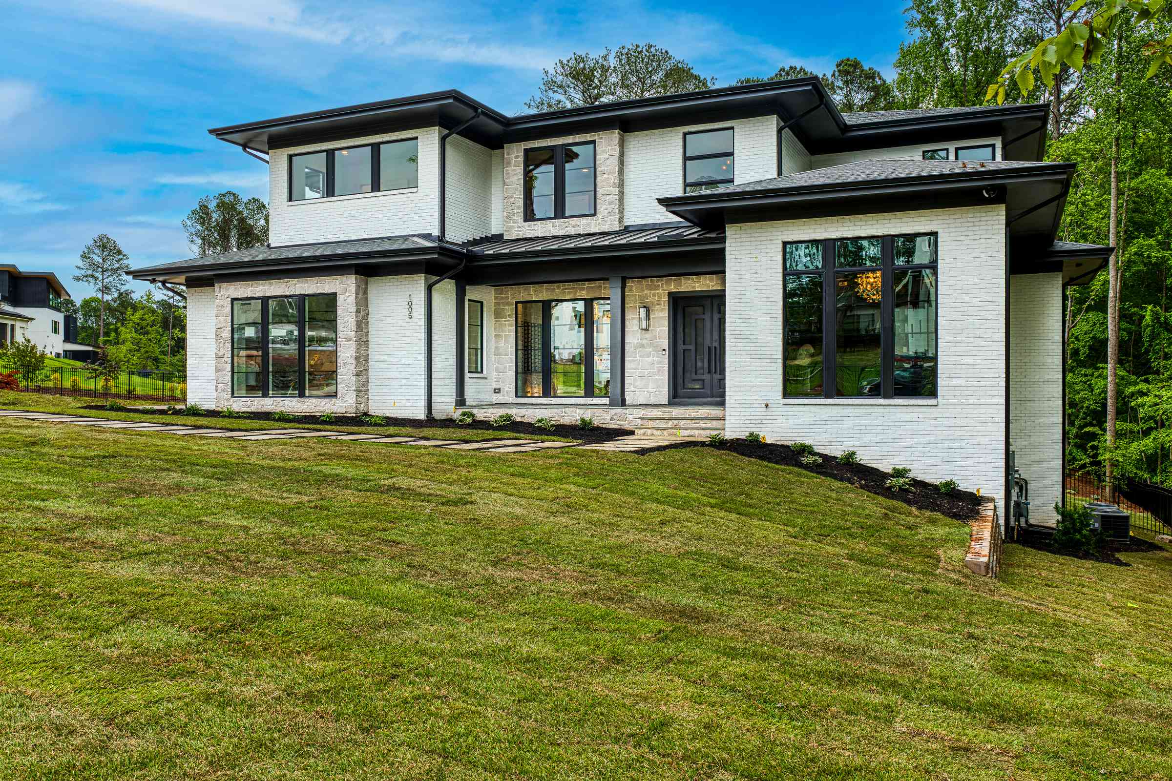 Modern transitional front exterior by Shail Construction in Raleigh NC