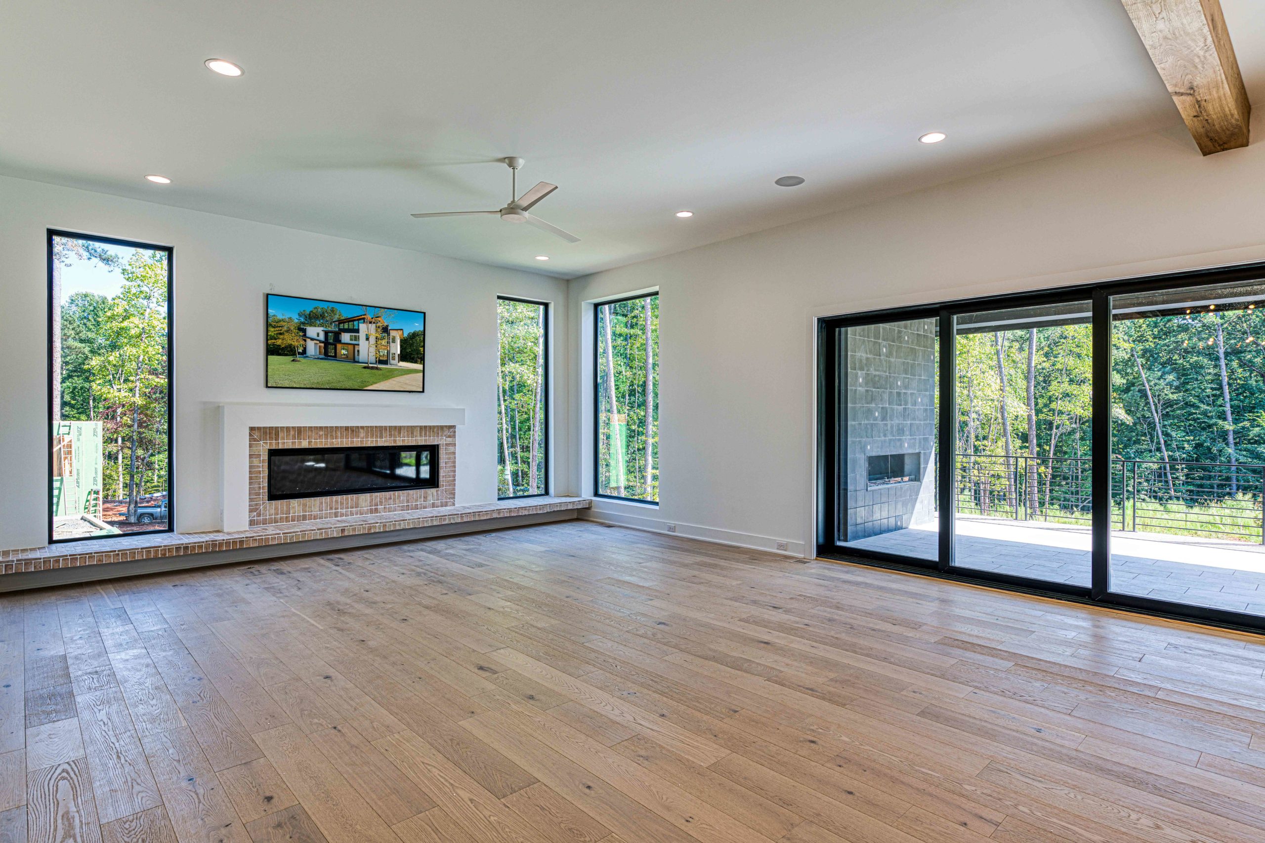 Family room with steel windows and coffered ceiling by Shail Construction in Raleigh NC