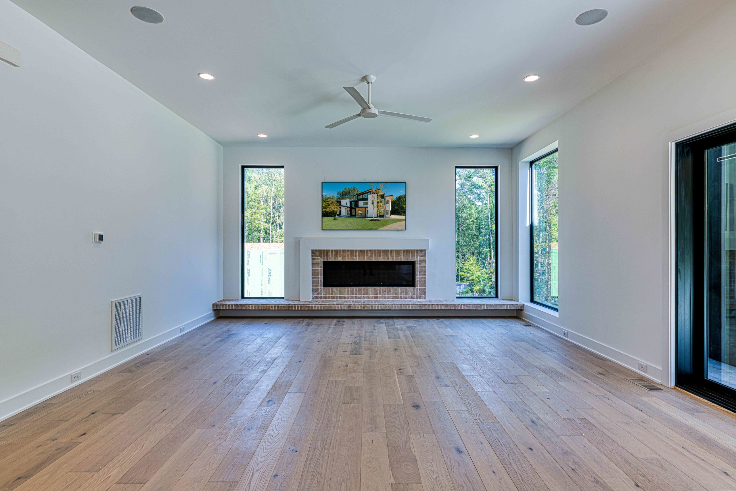 Family room with paneled walls and cathedral ceiling by Shail Construction in Raleigh NC