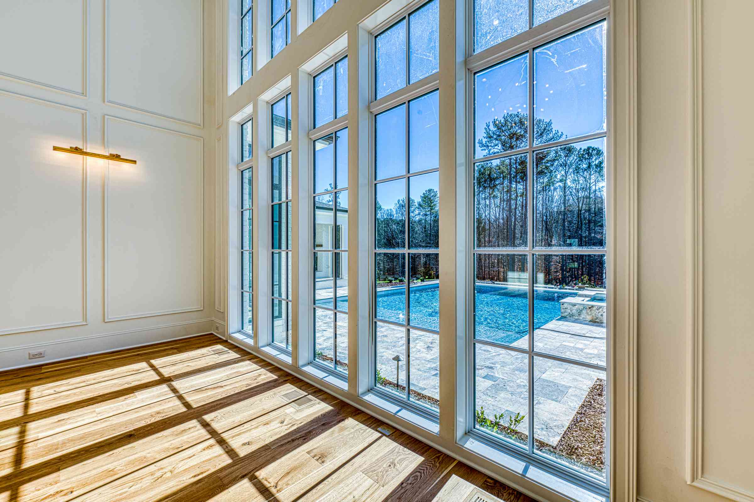 Family room with French doors to porch by Shail Construction in Raleigh NC
