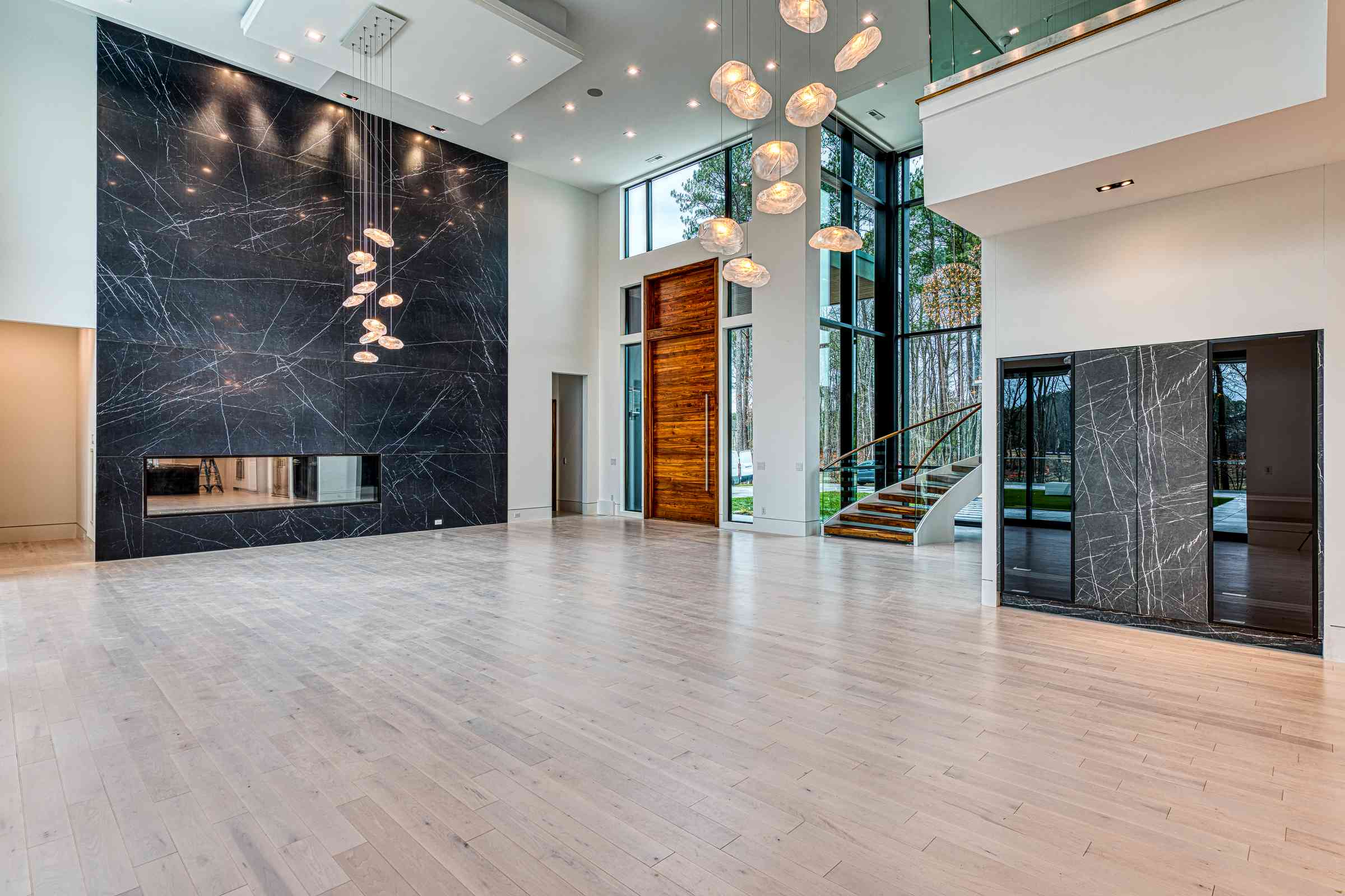 Great room with cathedral ceiling at Ressner Residence by Shail Construction in Cary NC