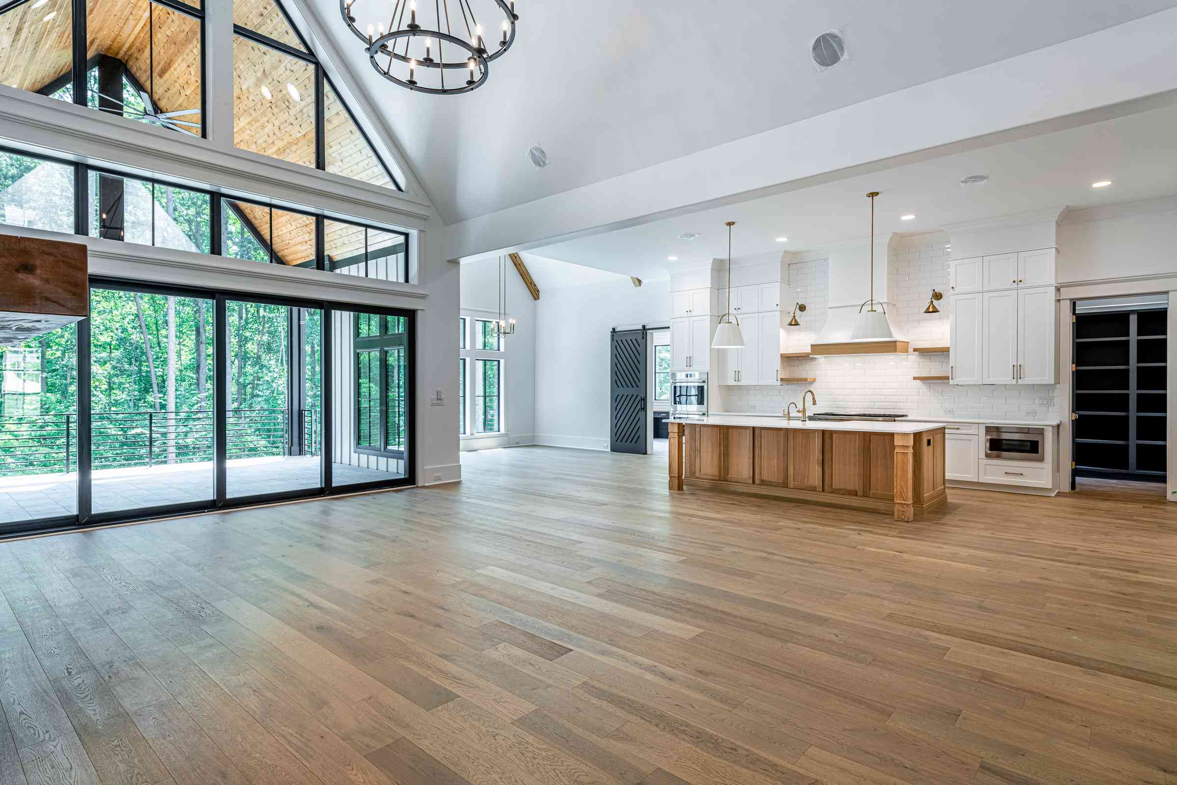 Two-story great room with steel windows by Shail Construction in Durham NC