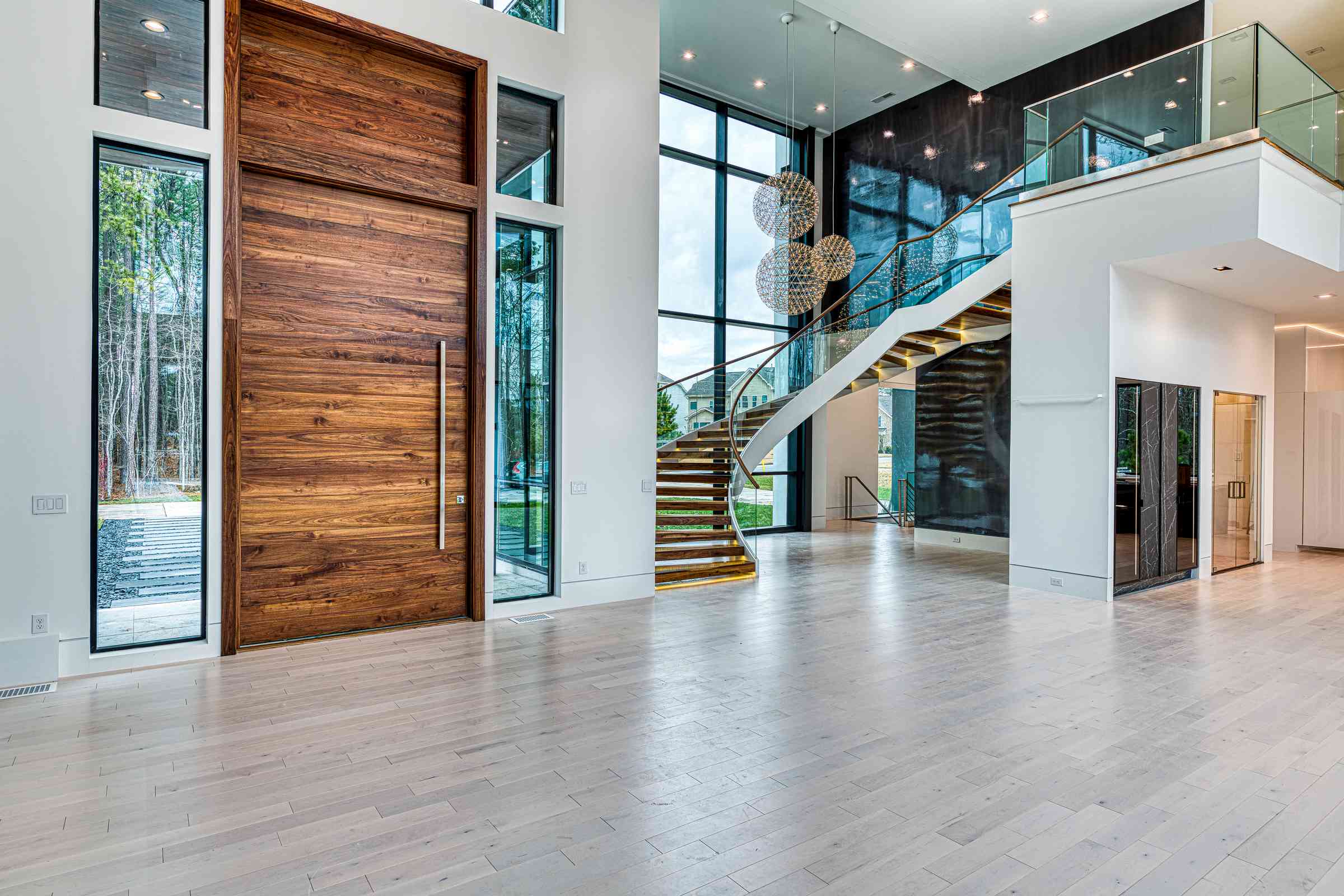 Grand entry foyer with crystal chandelier by Shail Construction in Cary NC