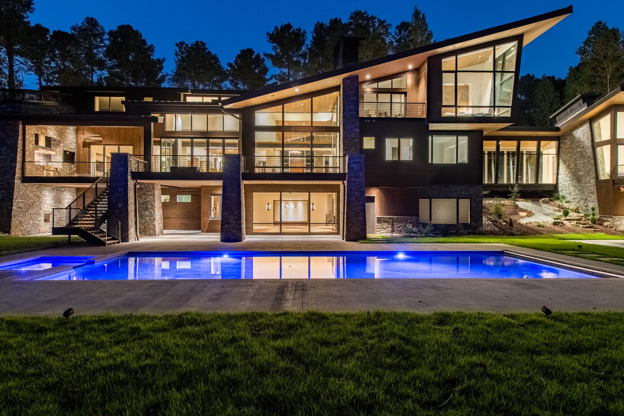 Luxury custom home and pool at evening by Shail Construction in Raleigh NC