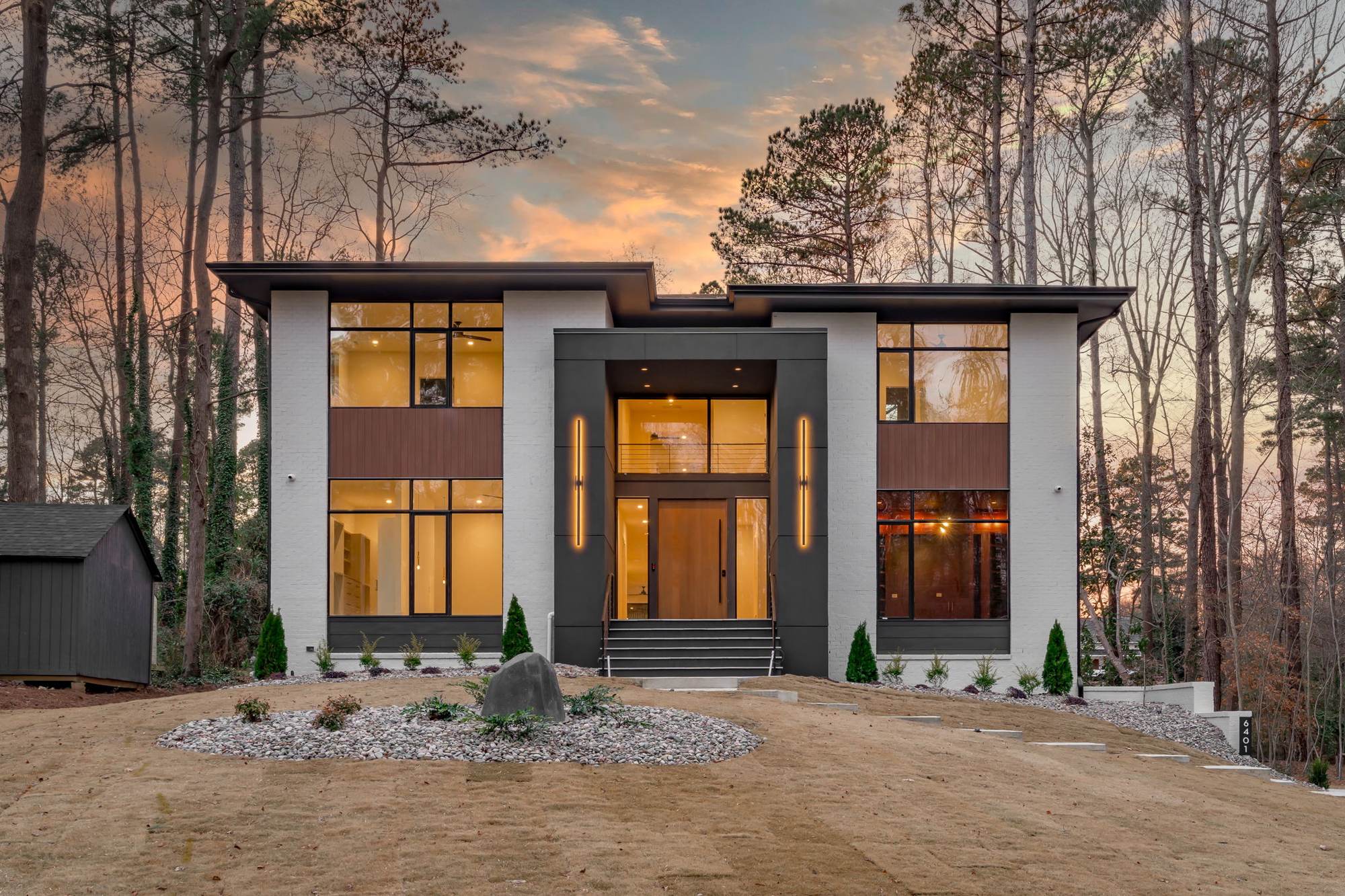 Modern custom home set in a wooded Raleigh landscape by Shail Construction