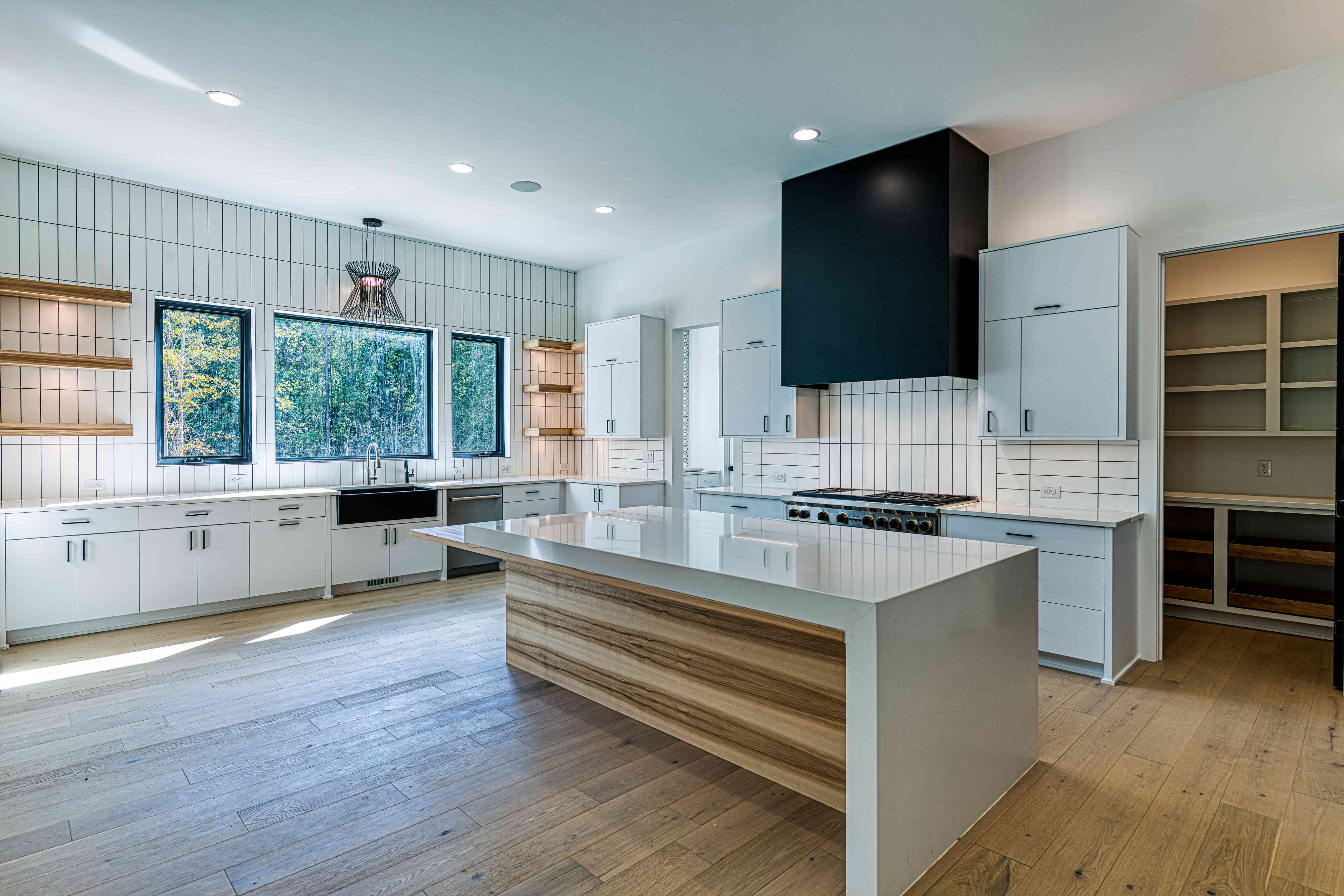 Designer range and statement hood by Shail Construction in Raleigh NC