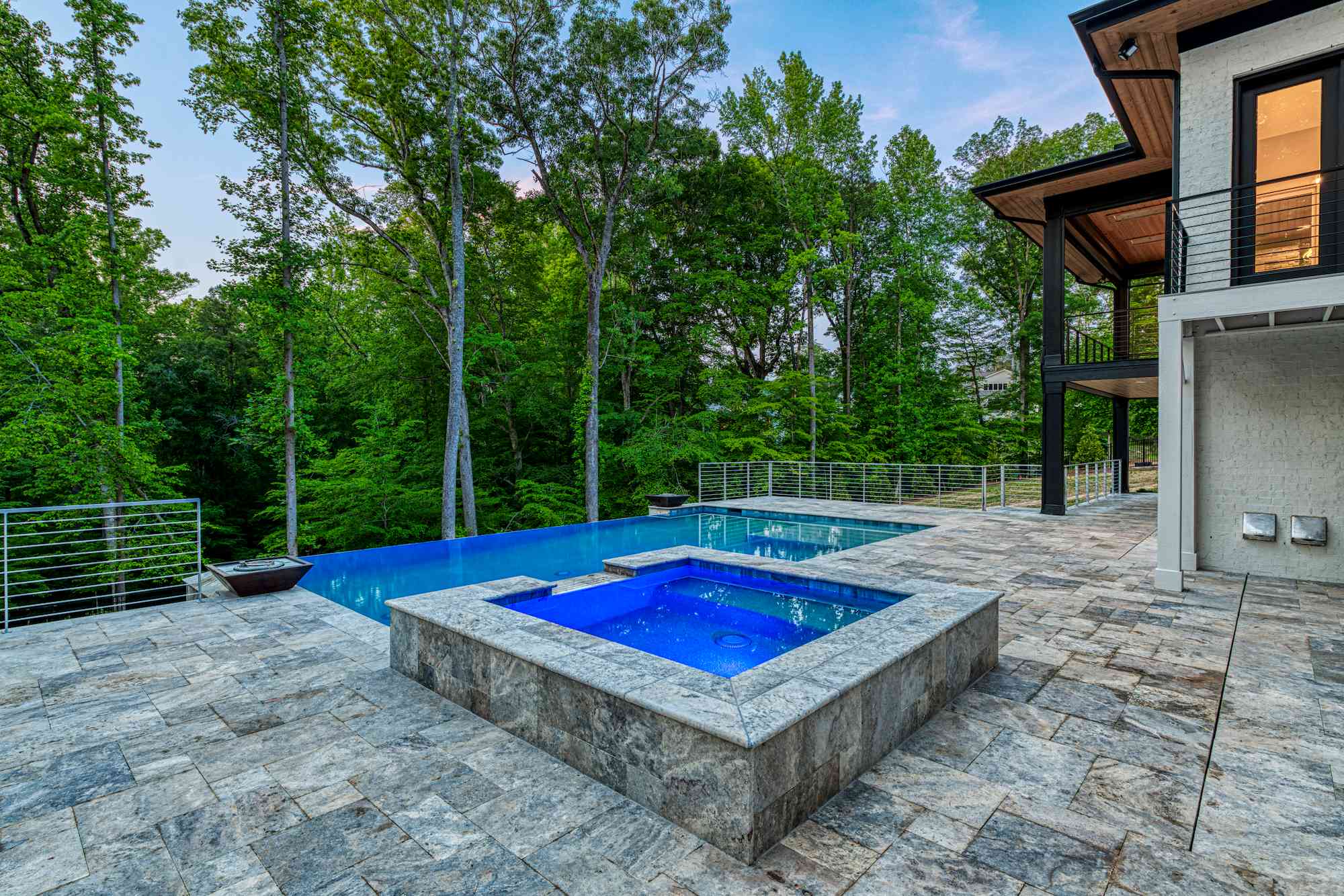 Afternoon pool with cabana and lounge chairs by Shail Construction in Raleigh NC
