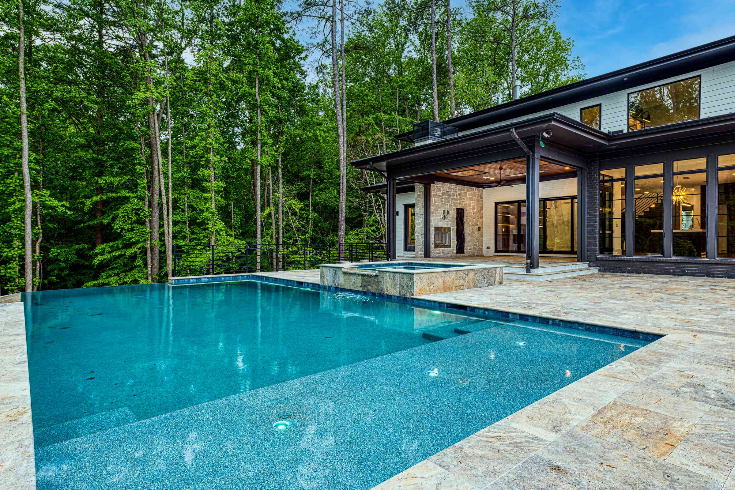 Pool deck with stone coping and clean lines by Shail Construction in Durham NC