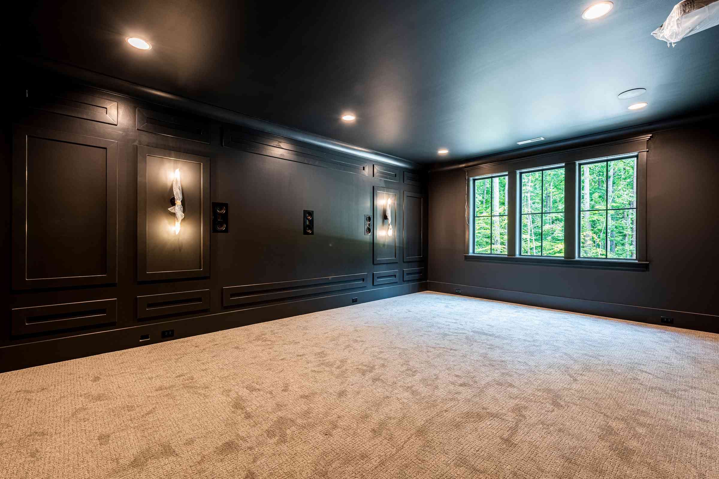 Custom home theater with tiered seating by Shail Construction in Raleigh NC