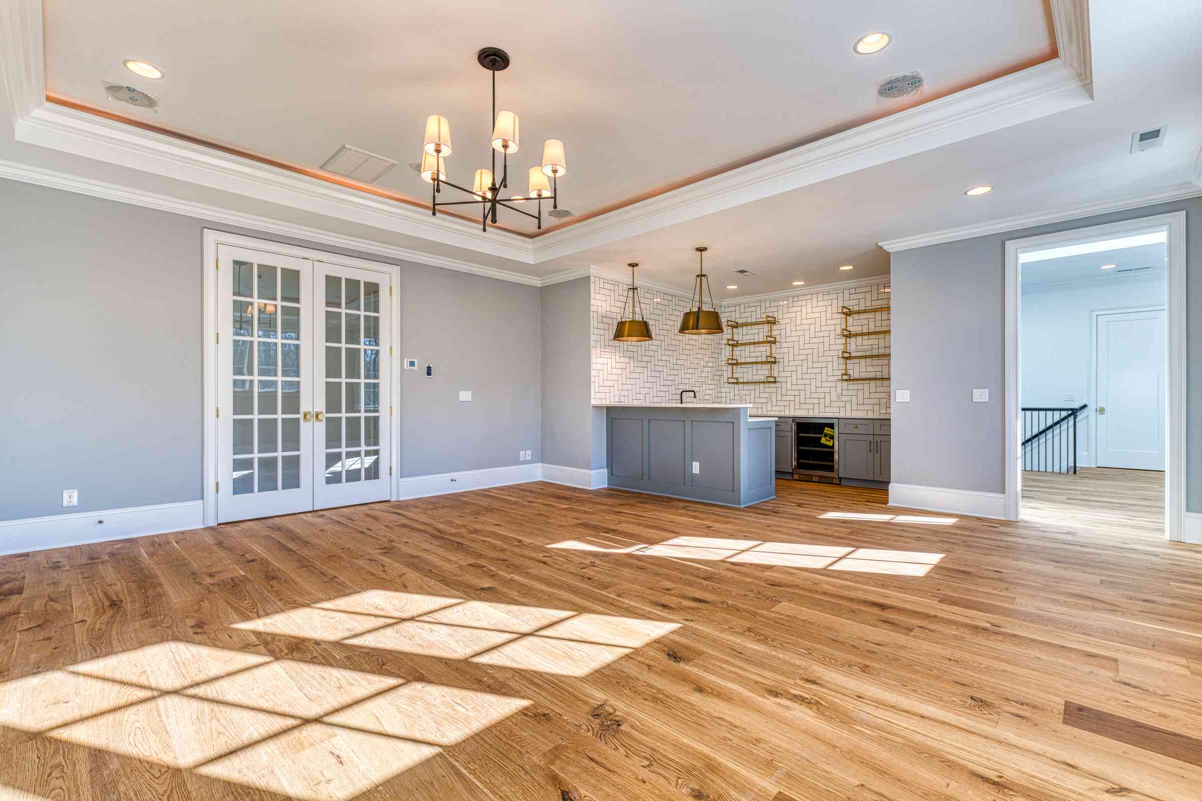 Media room with projector screen and lounge seating by Shail Construction in Raleigh NC