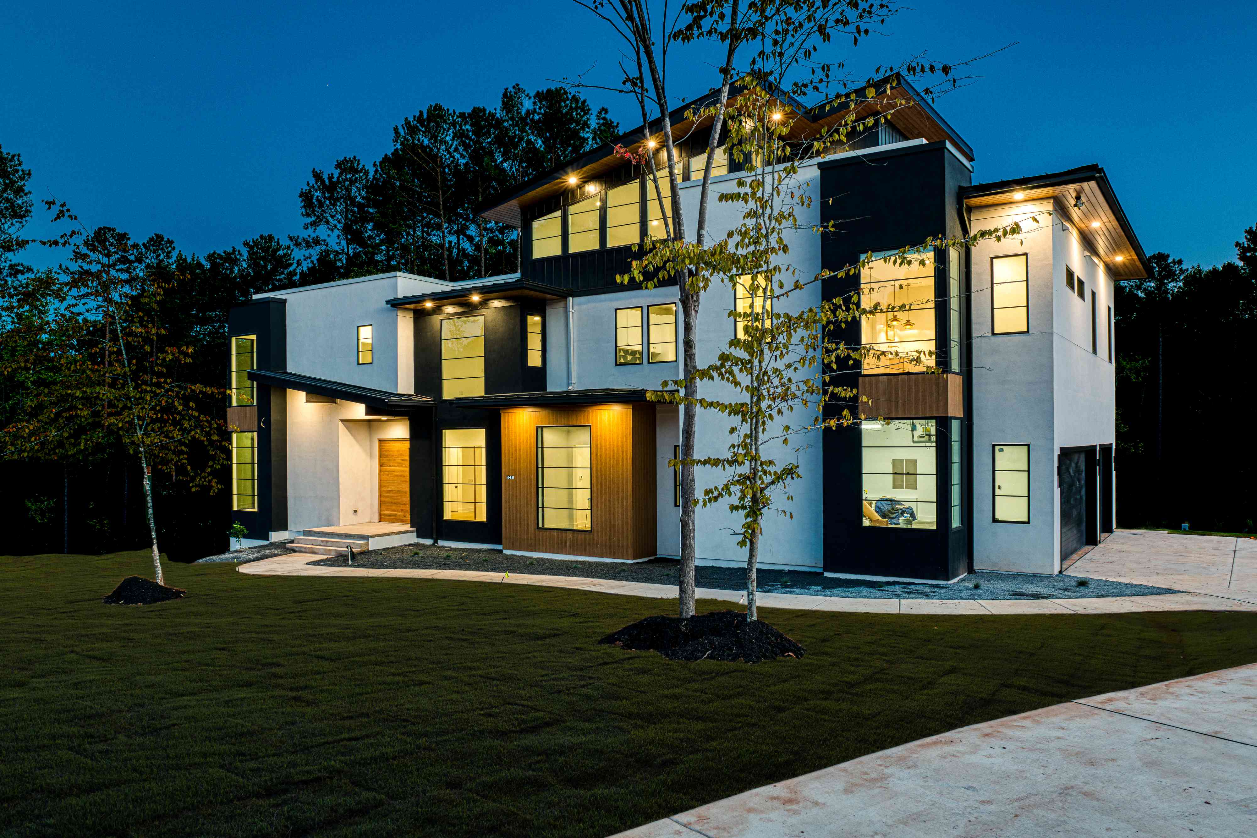 Front porch lit at twilight by Shail Construction in Raleigh NC