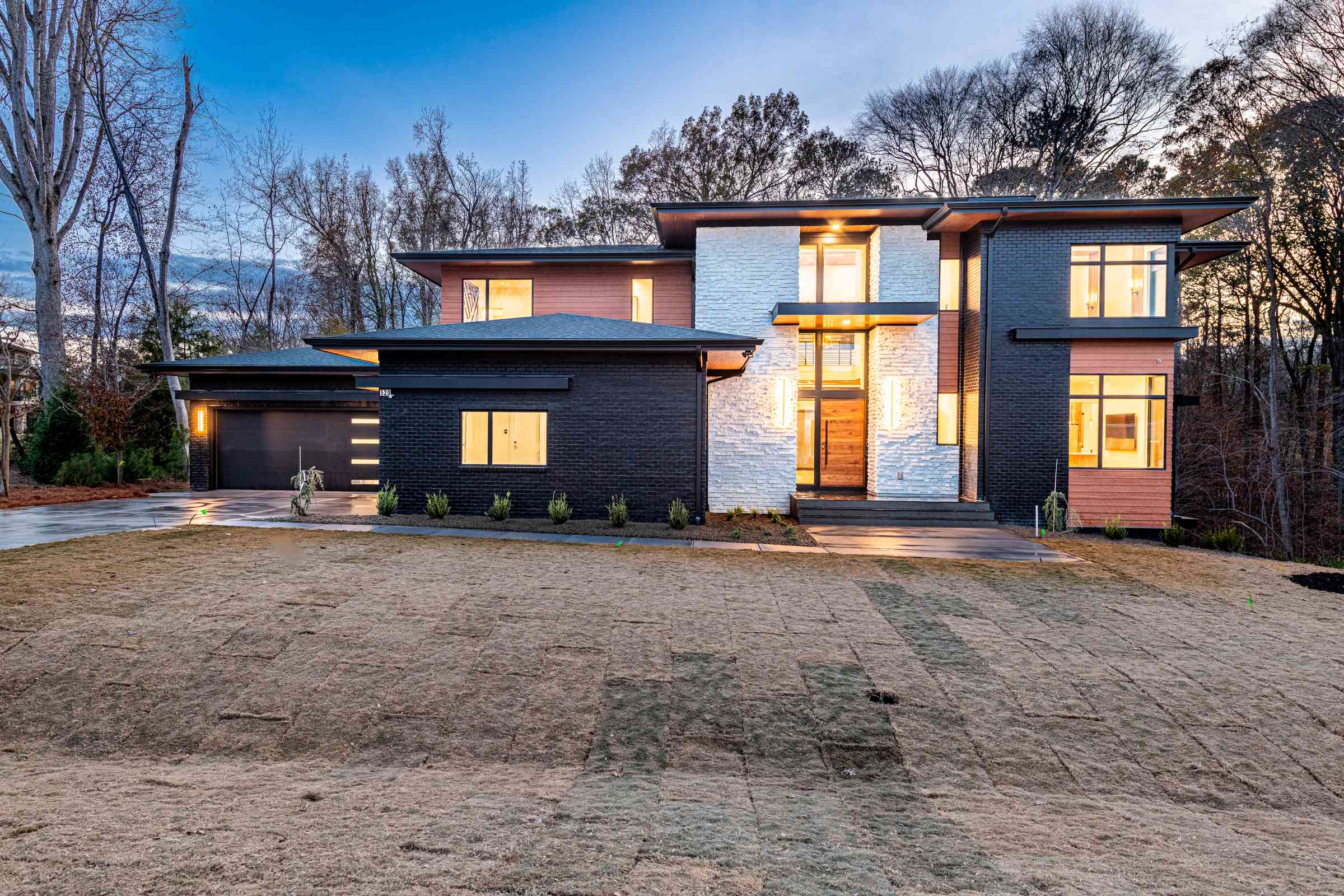 Twilight front exterior of Bella Terra estate by Shail Construction in Raleigh NC