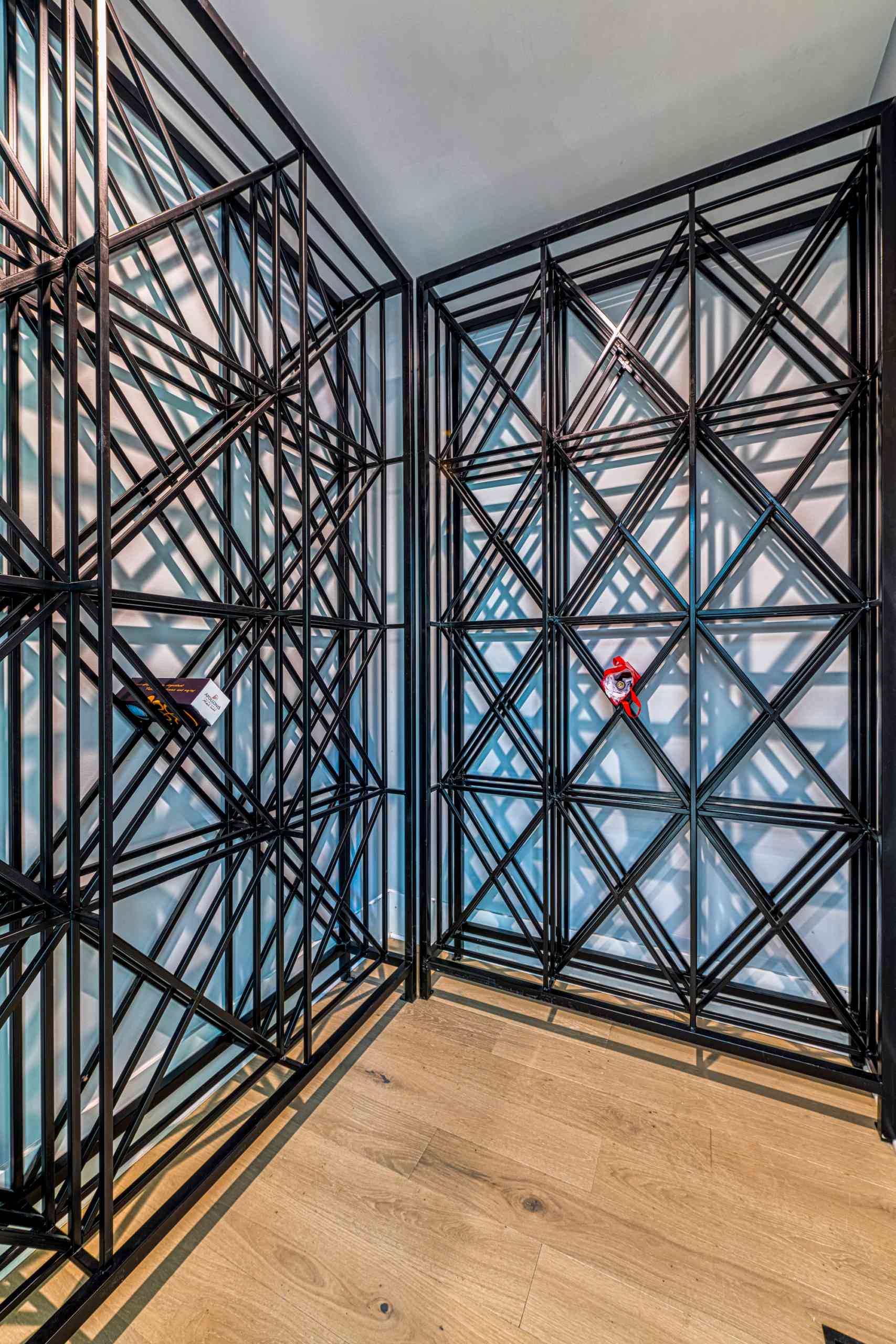 Walk-in wine cellar with leather seating by Shail Construction in Cary NC